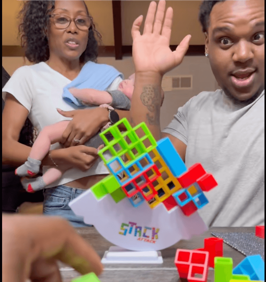 Family Playing Stack Attack Taking Turns