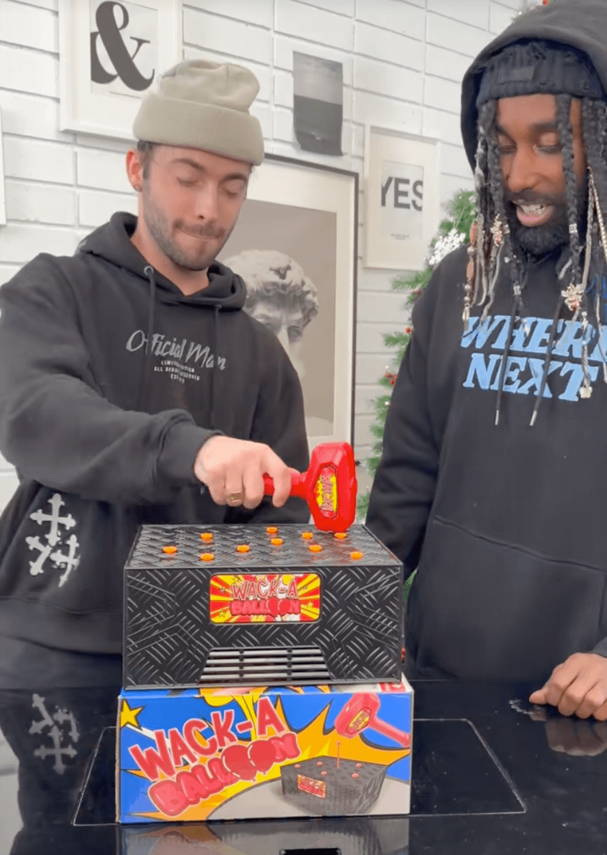 Joey Reed and friend playing Wack A Balloon